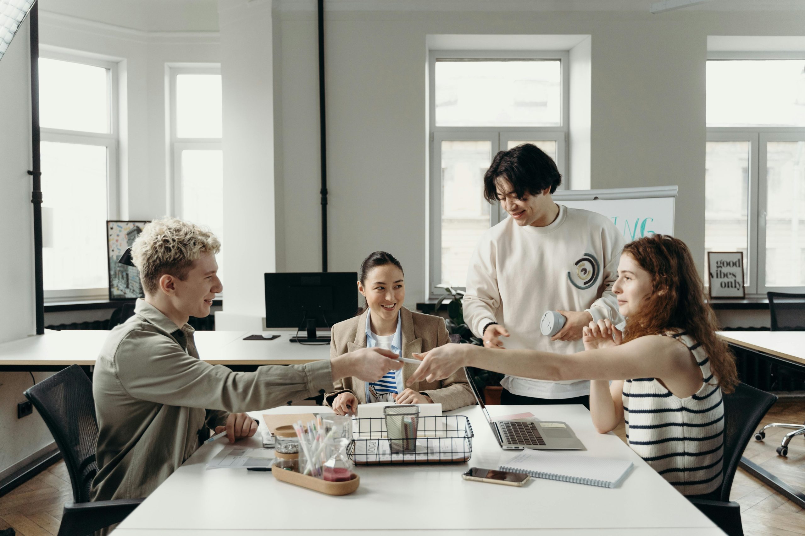 Featured image of employees collaborating.